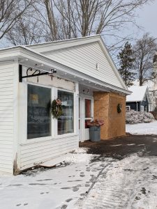 Exterior of a new studio building with snow on the ground