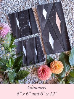 Glimmers quilt blocks in black fabric with white and pink star patterns, 6"x6" and 6"x12